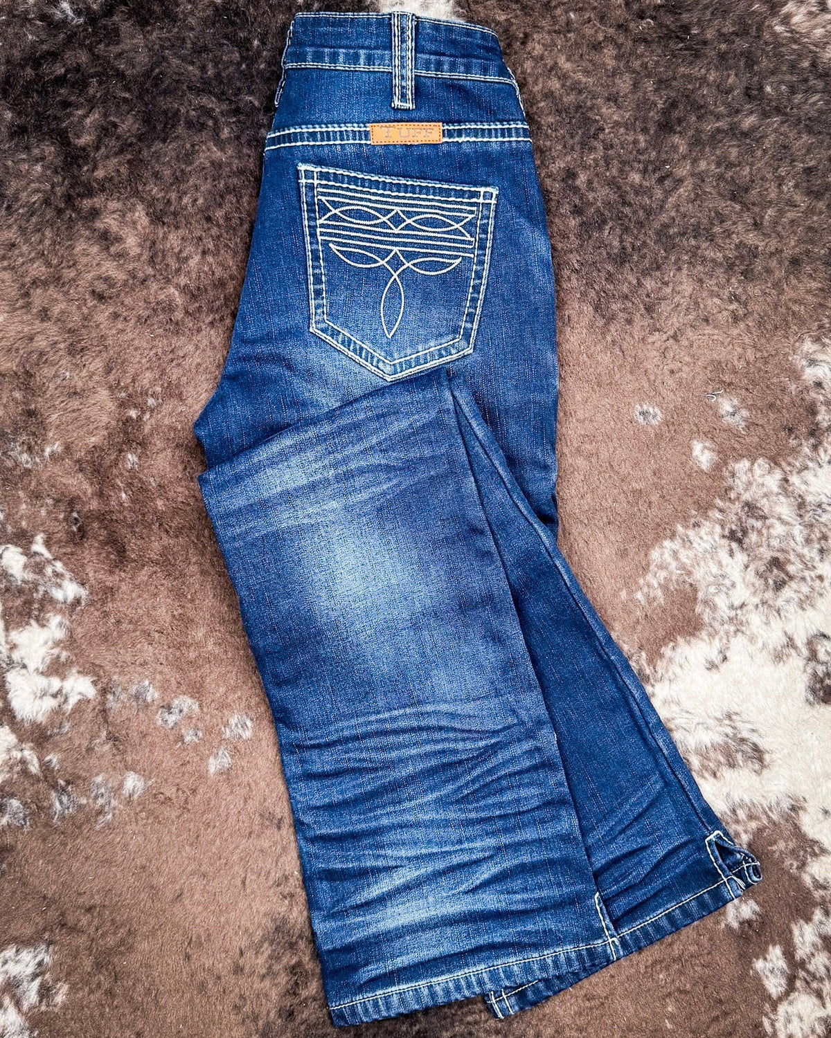 White Boot Stitch Flannel-Lined Bootcut Jeans by Cowgirl Tuff
