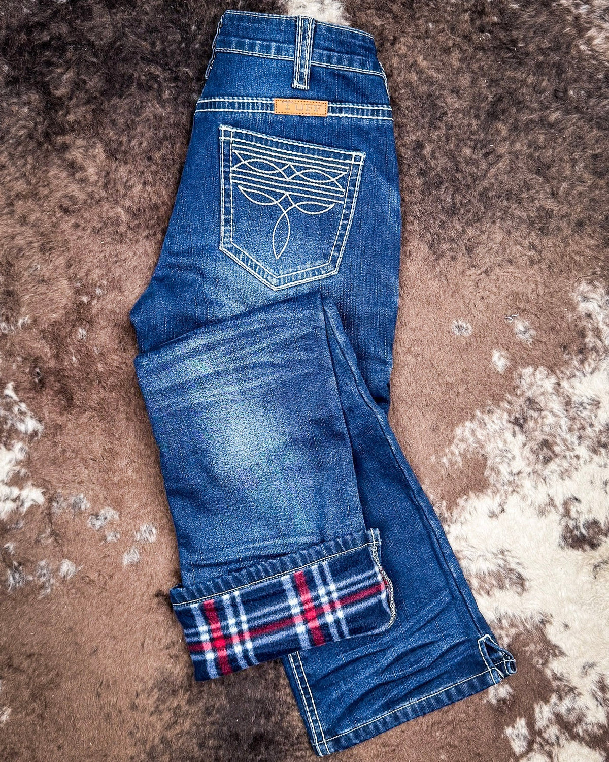 White Boot Stitch Flannel-Lined Bootcut Jeans by Cowgirl Tuff